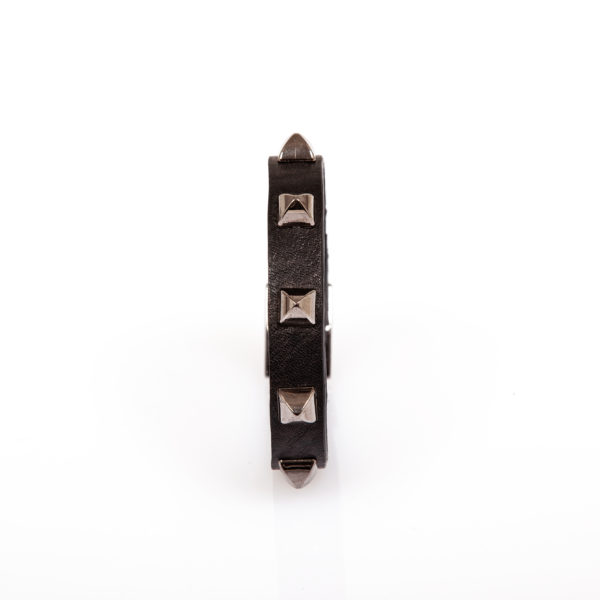 Black leather bracelet with cone-shaped studs